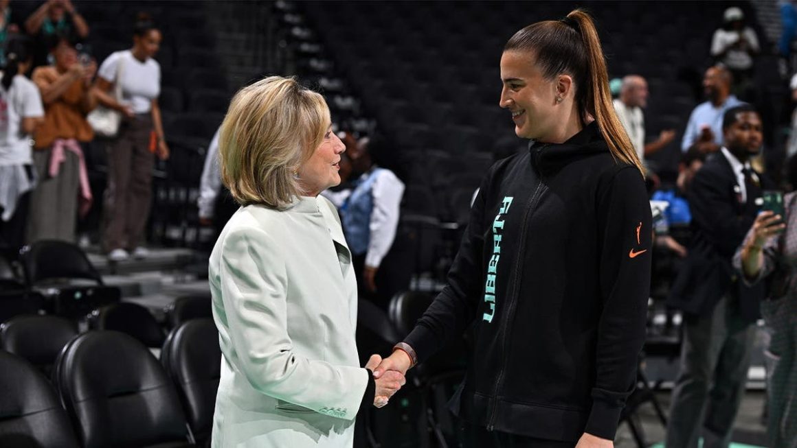 Hillary Clinton Spotted at WNBA Game, Enthralled by Mascot