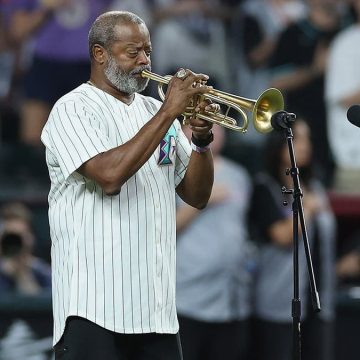 Retired Navy Petty Officer and Trumpeter Reflect on Powerful National Anthem Performances